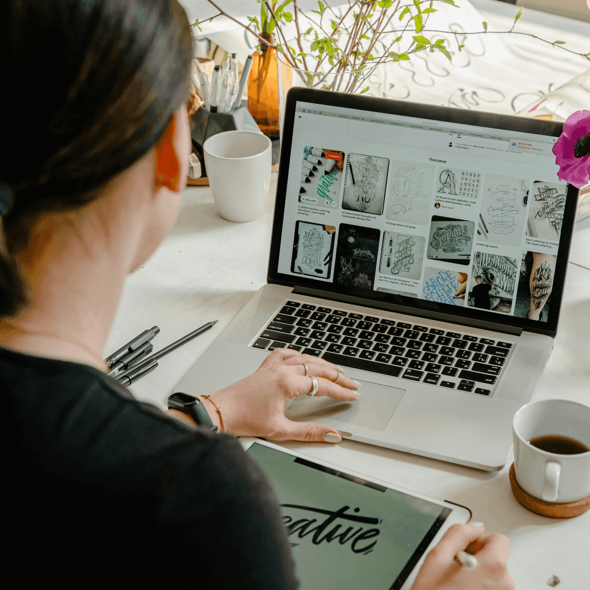 A recruiter reviewing modern website design templates on a laptop with notes on branding